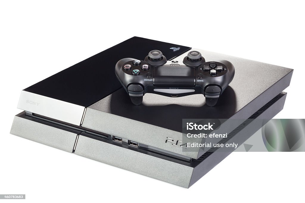 Playstation 4 Gaming Console With Controller Wrocław, Poland - December 29, 2013:  PlayStation 4 (PS4) with a DualShock controller. The PS4 is a video gaming console produced by Sony Computer Entertainment. Control Stock Photo