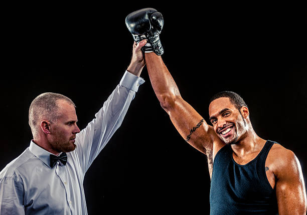 African American Male Boxer with judge African American Male Boxer with judge boxing referee stock pictures, royalty-free photos & images