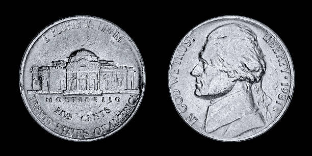 istock Used US Nickel isolated on black 460788239