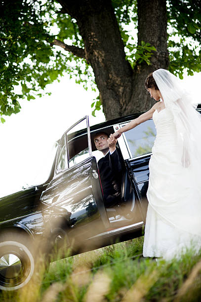istock Bride and groom in car 460798511