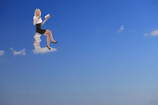 istock Woman reading book on the cloud. Blue sky. 460813693