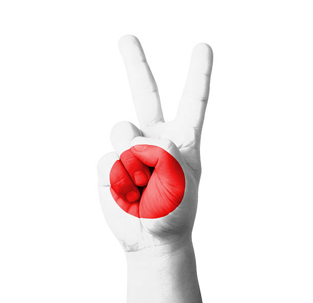 istock Hand making the V sign, Japan flag painted 460813989