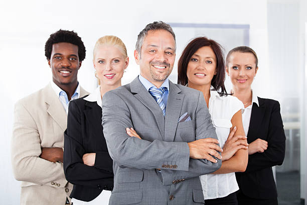 istock Smiling multi-racial business people in row 460817747