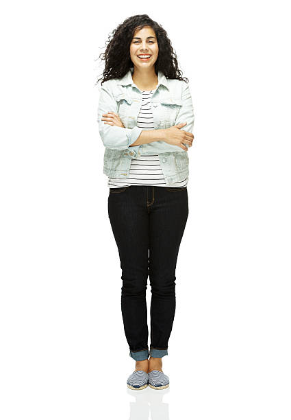 istock Smiling girl standing with arms crossed 460834359