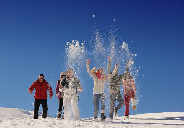 istock friends have fun at winter on fresh snow 460835911