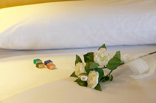 istock Bridal bed with roses and chocolates 460841841