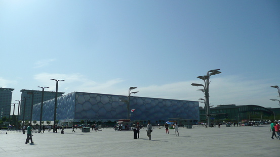 Beijing, China - May 24, 2012: A view of Beijing National Aquatics Center (National Aquatics Center), Beijing, China. Tourists and locals walk in front of the Center. Some take photos with the center. The center is located next to Beijing National Stadium.