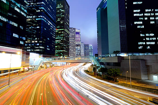 istock urban city with car light 460843413