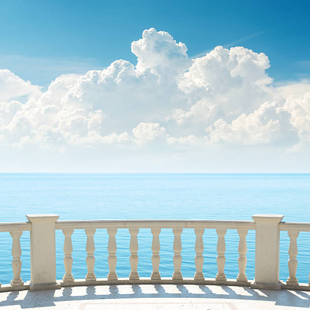 istock cloudy sky over sea and balcony 460844165