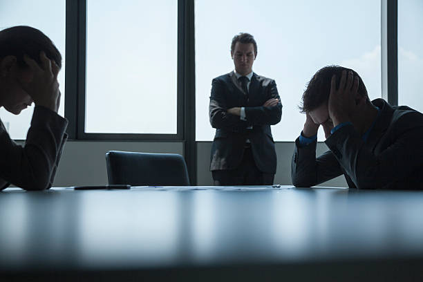 istock Three frustrated and overworked business people in the board room 460844323