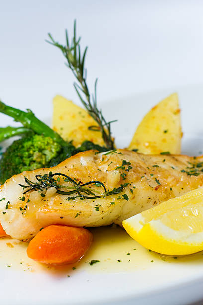 istock snow fish with a butter, lemon and rosemary 460844563