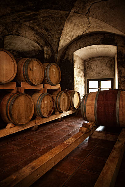 istock old fashioned wine cellar with wooden barique barrels 460856771