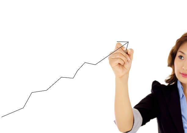 istock businesswoman drawing graph 460865939