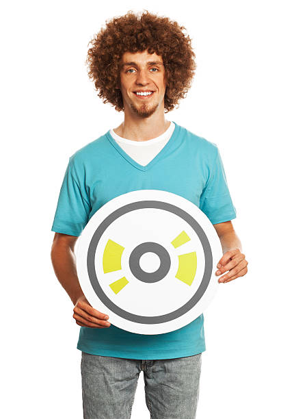 istock Smiling young man holding CD sign isolated on white background. 460868849