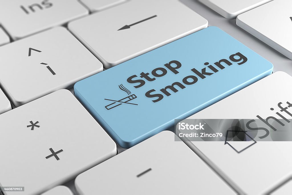 keyboard close up view with blue button stop smoking Stop smoking using a blue button with smoking ban icon in a elegant keyboard Addiction Stock Photo