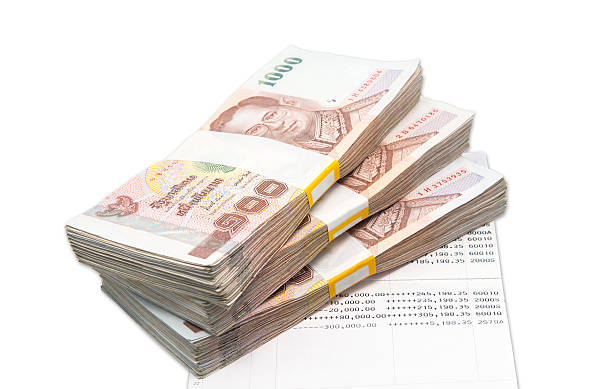 istock Stacks of 1000 baht bills on account book 460878189