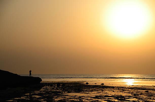istock photographer on sea 460898847