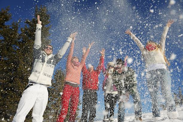 istock friends have fun at winter on fresh snow 460899753