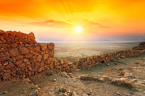 Beautiful sunrise over Masada fortress in Judaean Desert stock photo