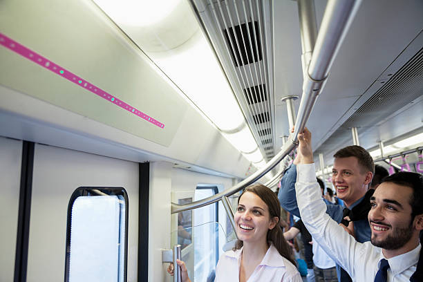istock Three business people on subway and looking at map 460915841