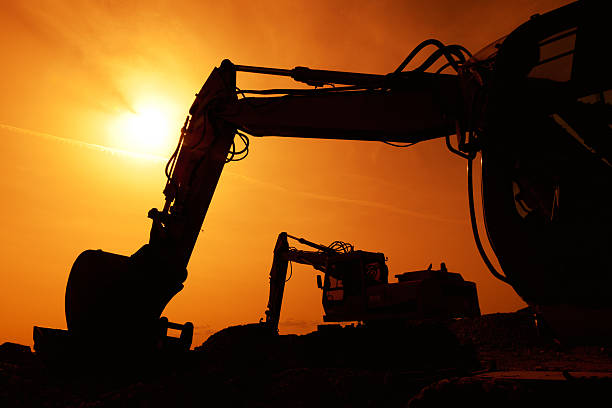 istock earth mover buldozer silhouette again sunest light 460920819