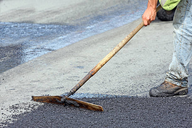 istock Road Repair, Raking Hot Asphalt 460921135