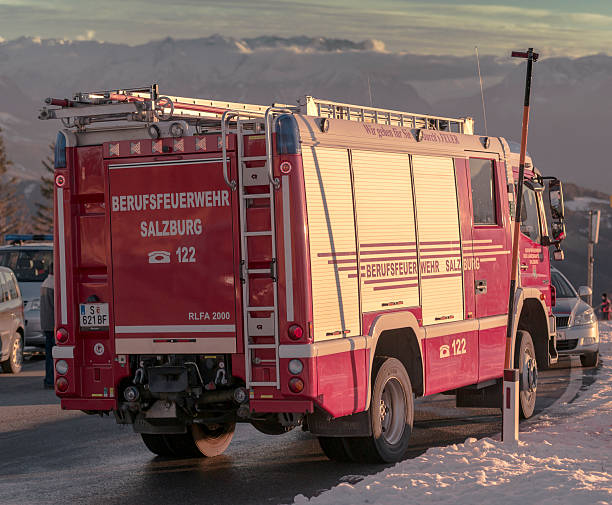 mountain rescue Salzburg, Austria - December 30, 2013: Emergency vehicles of the fire department, paramedics, police and mountain rescue at the top of the Gaisberg in Salzburg. A paraglider crashed shortly after takeoff. In the background the Austrian Alps. gaisberg stock pictures, royalty-free photos & images