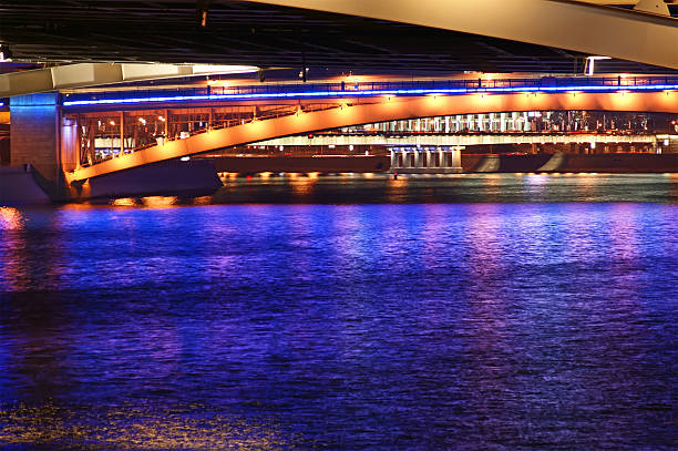 istock bridges on the river at night with lights reflected 460936803