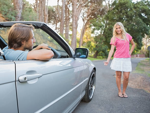 istock Beautiful hitchhiker finding a lift 460939571