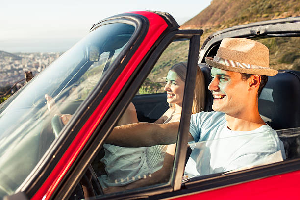 istock Couple driving in a red convertible 460939613