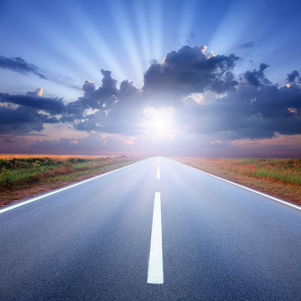 istock Driving on asphalt road towards the sunbeams 460941941