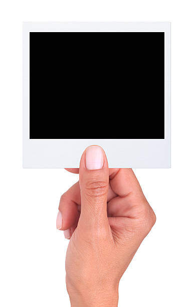 istock Hand holding a blank photo (Isolated) 460962291