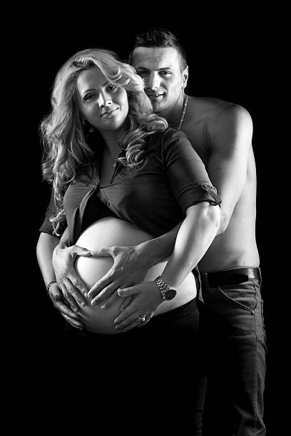 istock Young family on black background 460982485