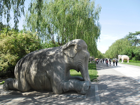 Beijing, China - May 24, 2012: A view of Ming Dynasty Tombs, Beijing, China. Statueslocated on the sacred walk of the Ming Dynasty Tombs. The site of the Tombs was chosen according to Feng Shui (Geomancy). Some Chinese Emperors are buried in this area. It is listed as a UNESCO World Heritage Site