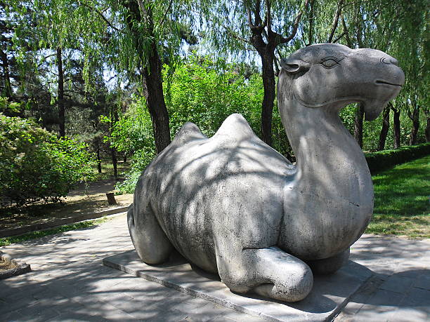 Beijing, China - May 24, 2012: A view of Ming Dynasty Tombs, Beijing, China. A statue located on the sacred walk of the Ming Dynasty Tombs. The site of the Tombs was chosen according to Feng Shui (Geomancy). Some Chinese Emperors are buried in this area. It is listed as a UNESCO World Heritage Site