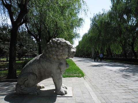 Beijing, China - May 24, 2012: A view of Ming Dynasty Tombs, Beijing, China. A statue located on the sacred walk of the Ming Dynasty Tombs. The site of the Tombs was chosen according to Feng Shui (Geomancy). Some Chinese Emperors are buried in this area. It is listed as a UNESCO World Heritage Site.