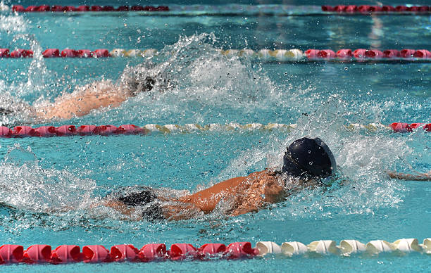istock Male freestyle swimmers in a race 461034819