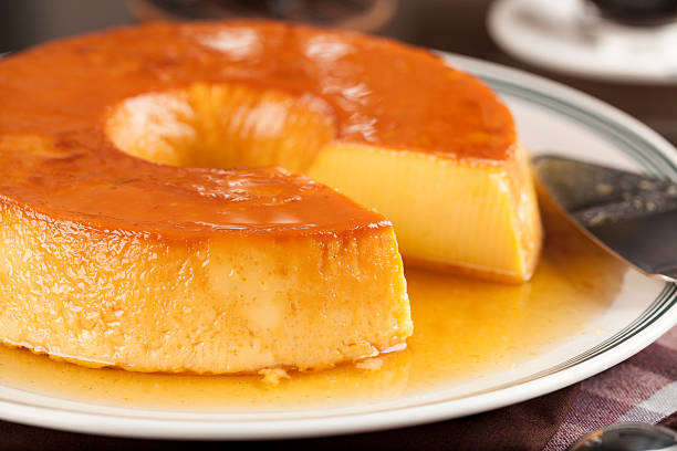 pudding Pudim, a delicious brazilian dessert, made from condensed milk. dessert stock pictures, royalty-free photos & images