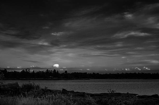 istock Lone cloud at night over a northern lake 461044609