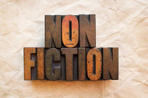 The word Nonfiction written in vintage wood letterpress type.