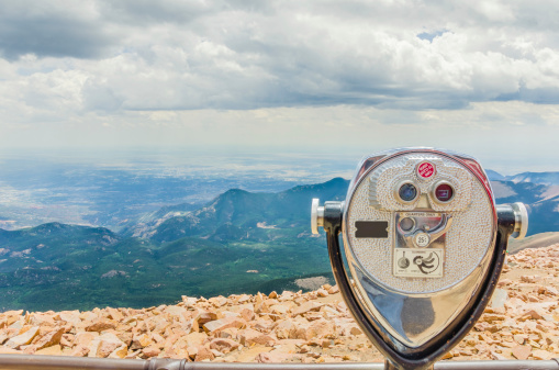 Tourist binoculars at the summit of Pikes Peak Mountain on a cloudy day
