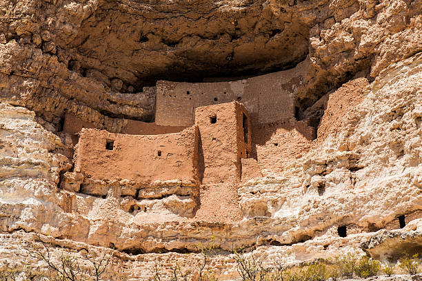 Montezuma Castle A pueblo cliff dwelling in the Montezuma Castle National Monument was home to the Sinagua people over 600 years ago. cliff dwelling stock pictures, royalty-free photos & images