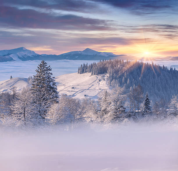 istock Beautiful winter sunrise in mountain village 461052775