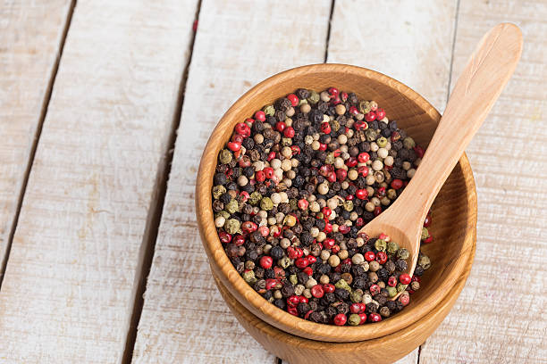 istock Mixed pepper in bowl  on wooden background 461060059