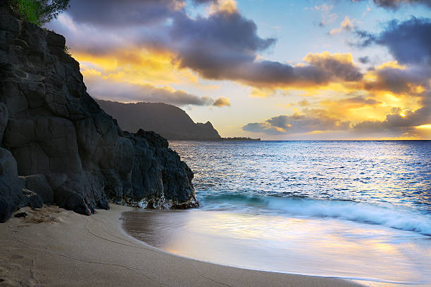 Hideaway Beach Sunset at hideaway beach Kauai Hawaii hanalei bay stock pictures, royalty-free photos & images