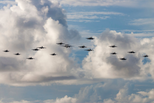 United States Navy aircraft performing a formation flyover.