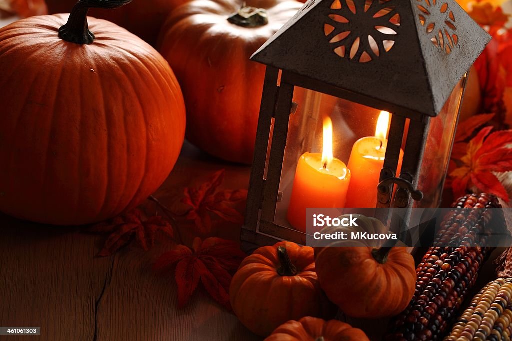 Autumn still life Lantern with burning candles and pumpkins. Autumn Stock Photo