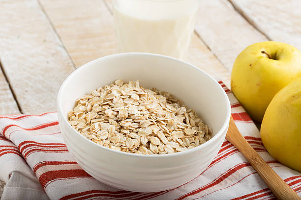 istock Oat flakes in bowl with apples and milk 461061731