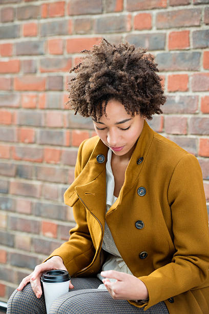istock Young Woman checking her mobile phone. 461067957