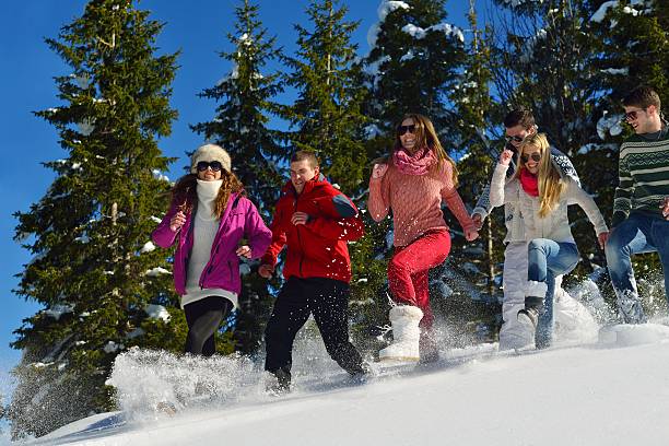istock friends have fun at winter on fresh snow 461087683